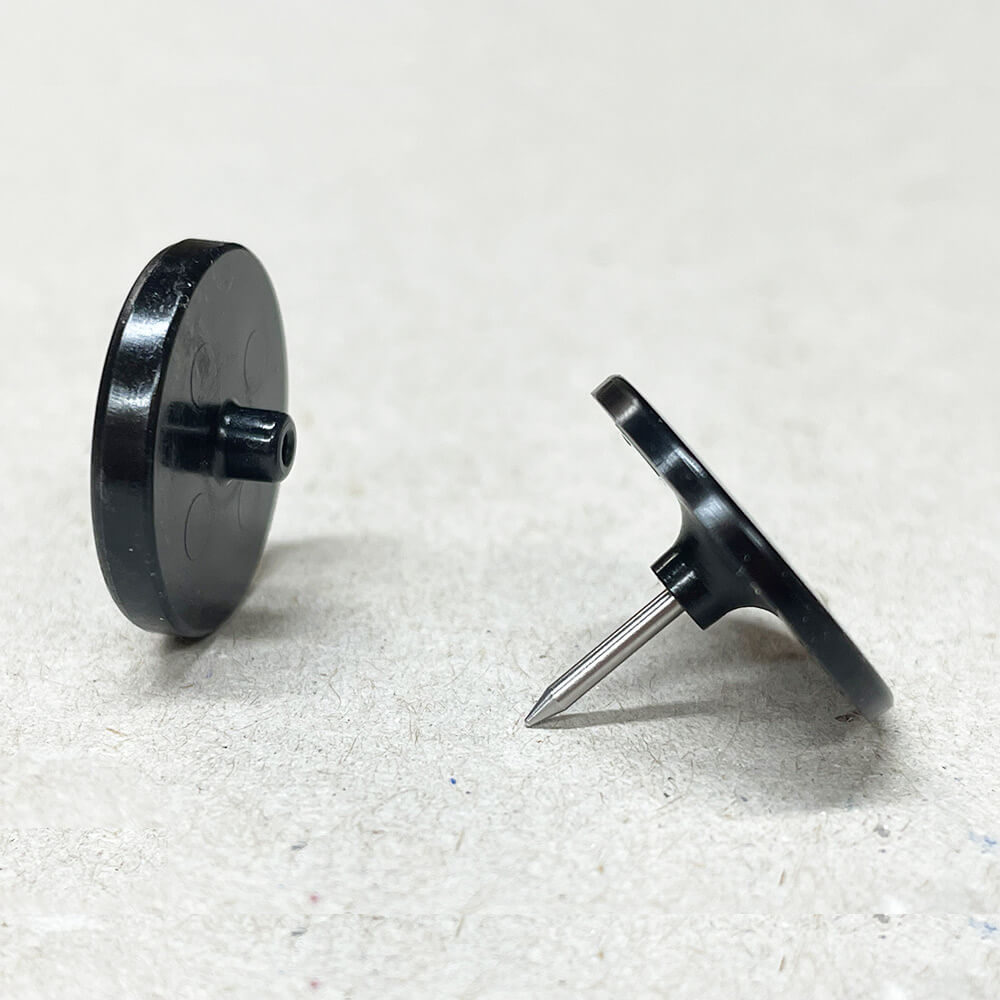 Two pieces of the Beanie Buttons